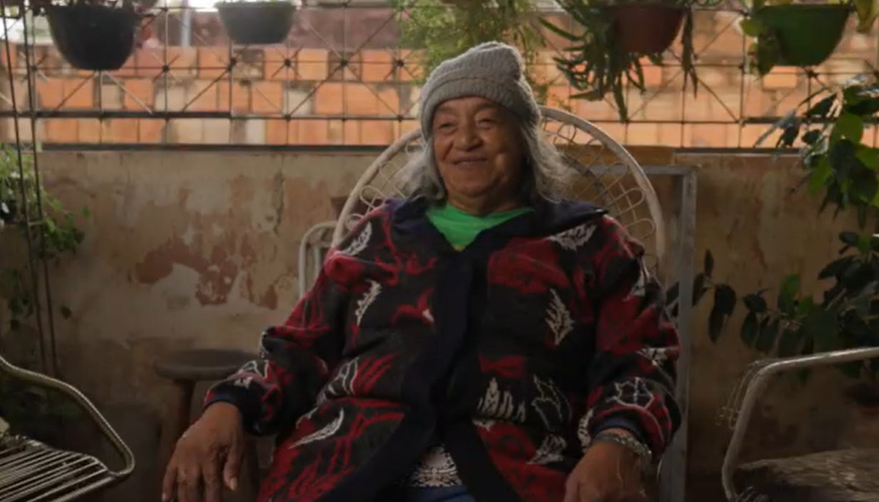 Dona Rose vendendo o seu peixe