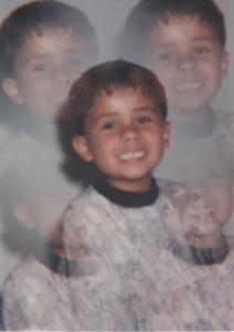 O filho com oito anos no batismo.